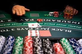 Blackjack hand in progress on fujiwin88 login showing player cards, dealer card, and action buttons
